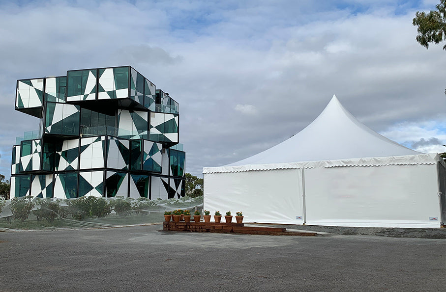 Large white crest tent setup by Extreme Marquess